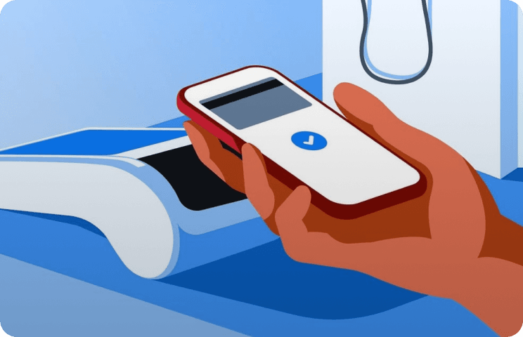 Hand holding a smartphone near a payment terminal